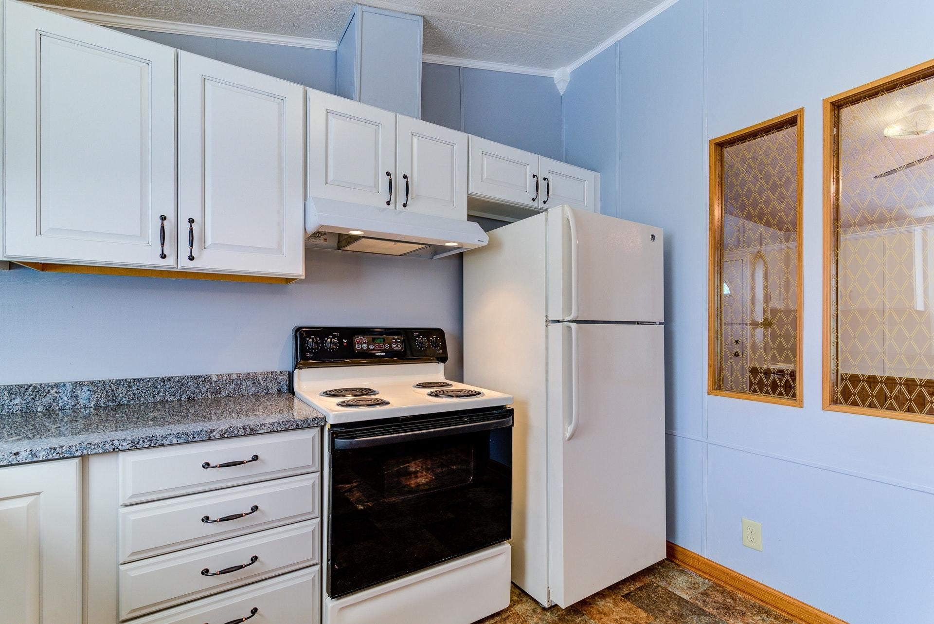 1103 Milton Road Blue Ridge, VA 24064 - Photo 13 of 29 a kitchen with stainless steel appliances granite countertop a refrigerator and a stove