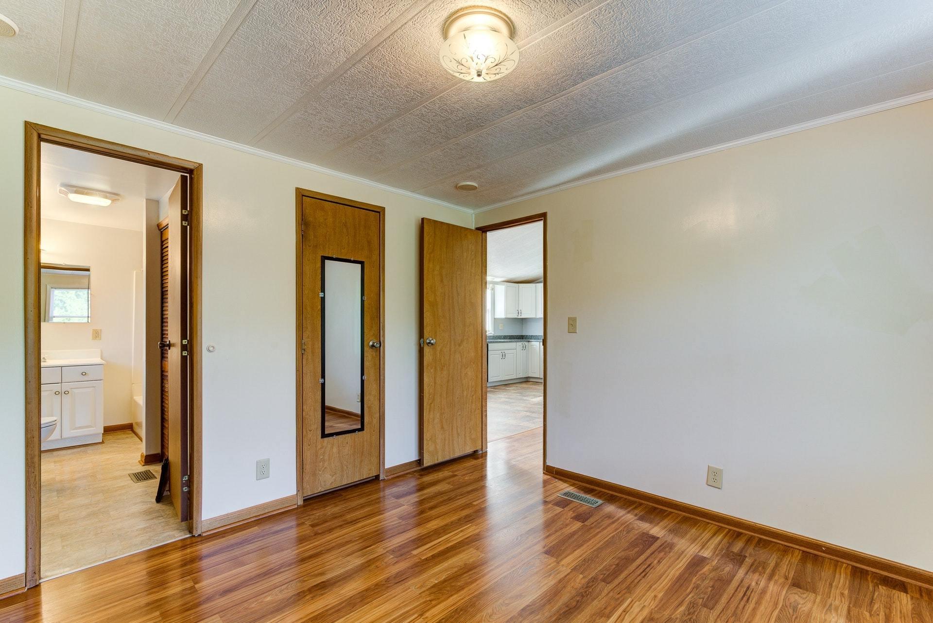 1103 Milton Road Blue Ridge, VA 24064 - Photo 16 of 29 a view of an empty room with wooden floor and a window