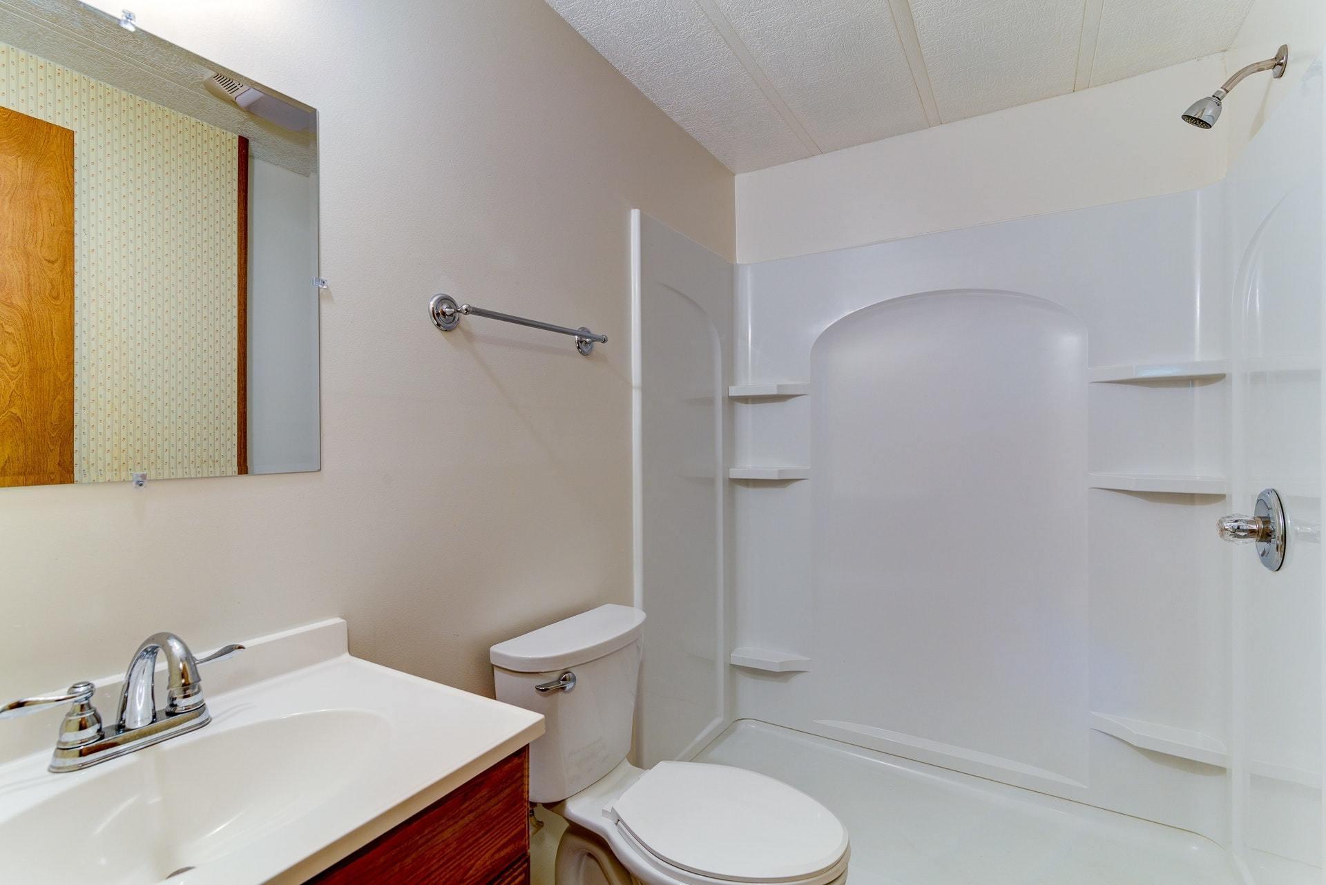 1103 Milton Road Blue Ridge, VA 24064 - Photo 20 of 29 a bathroom with a sink toilet and shower