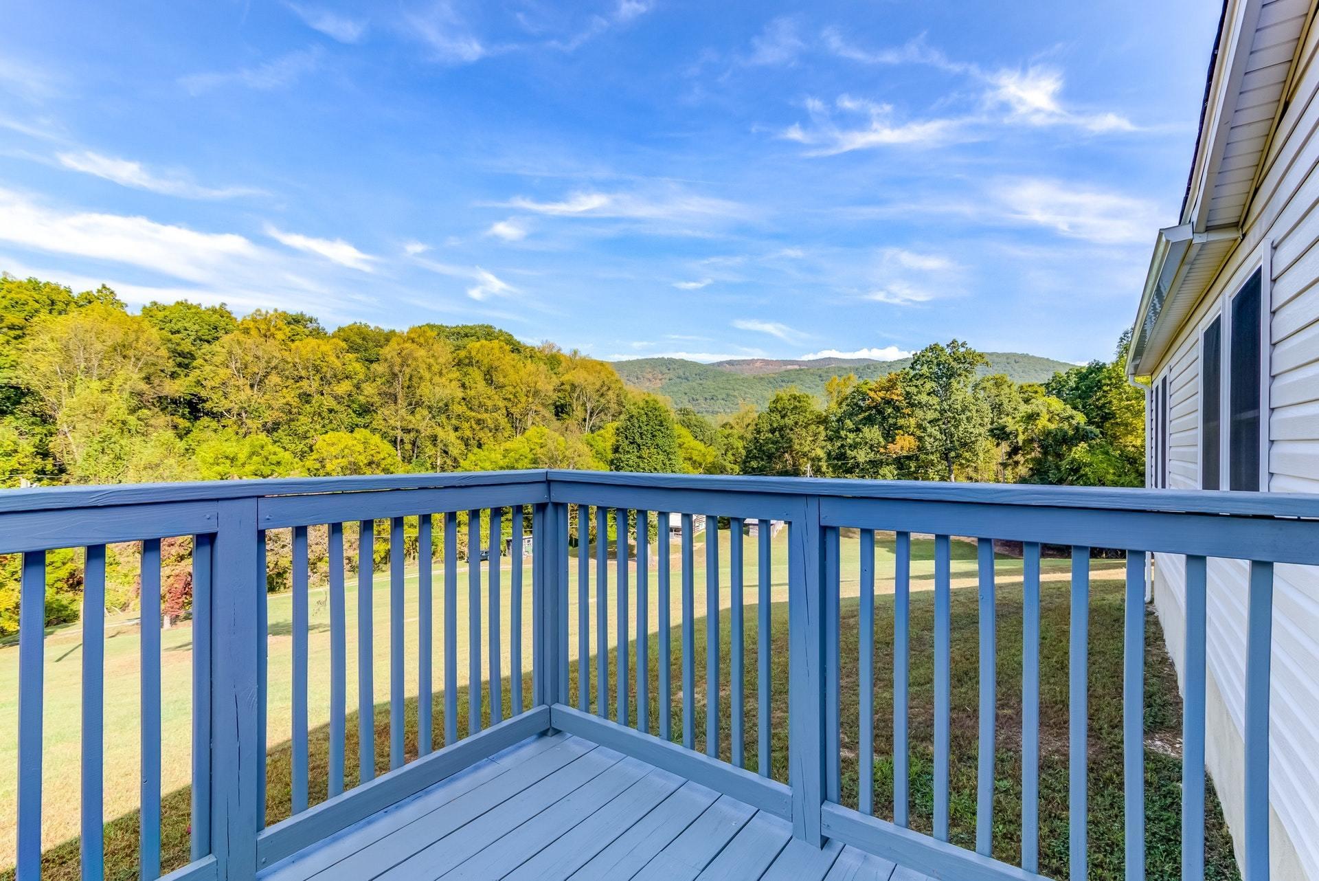 1103 Milton Road Blue Ridge, VA 24064 - Photo 5 of 29 a view of a balcony with wooden fence