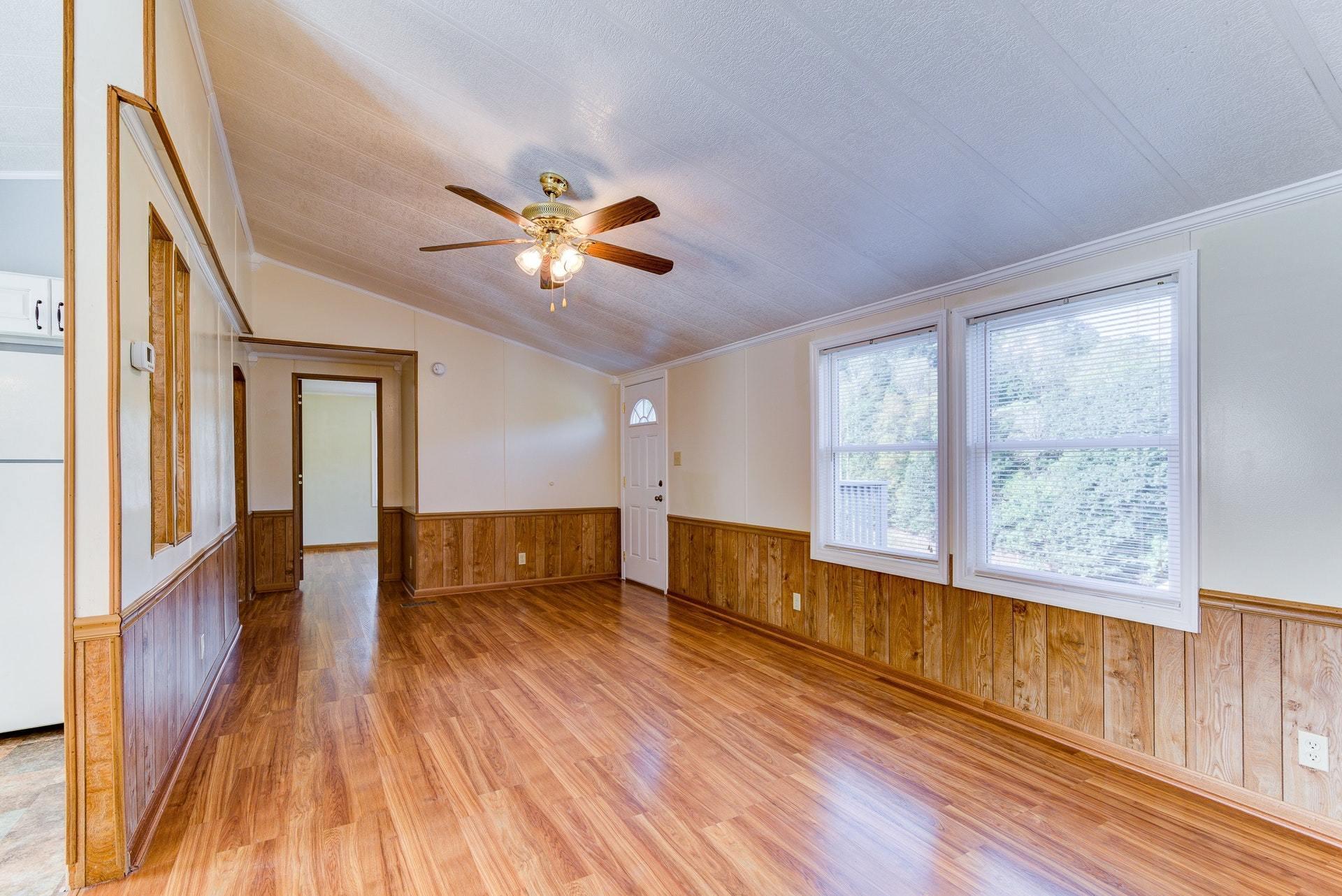 1103 Milton Road Blue Ridge, VA 24064 - Photo 8 of 29 a view of an empty room with wooden floor and a window