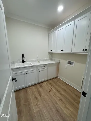 a kitchen with a sink and cabinets