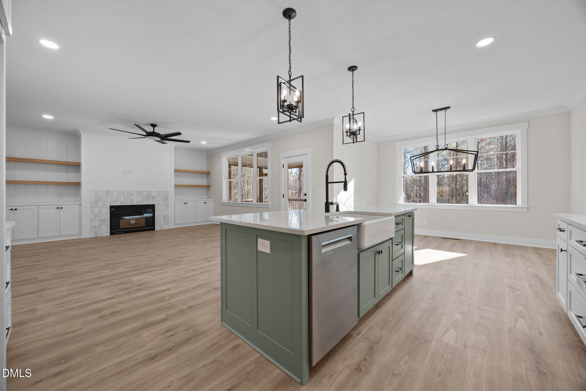 357 Slocum Drive Wendell, NC 27591 - Photo 16 of 48 a kitchen with stainless steel appliances granite countertop a sink and dishwasher a stove top oven with wooden floor