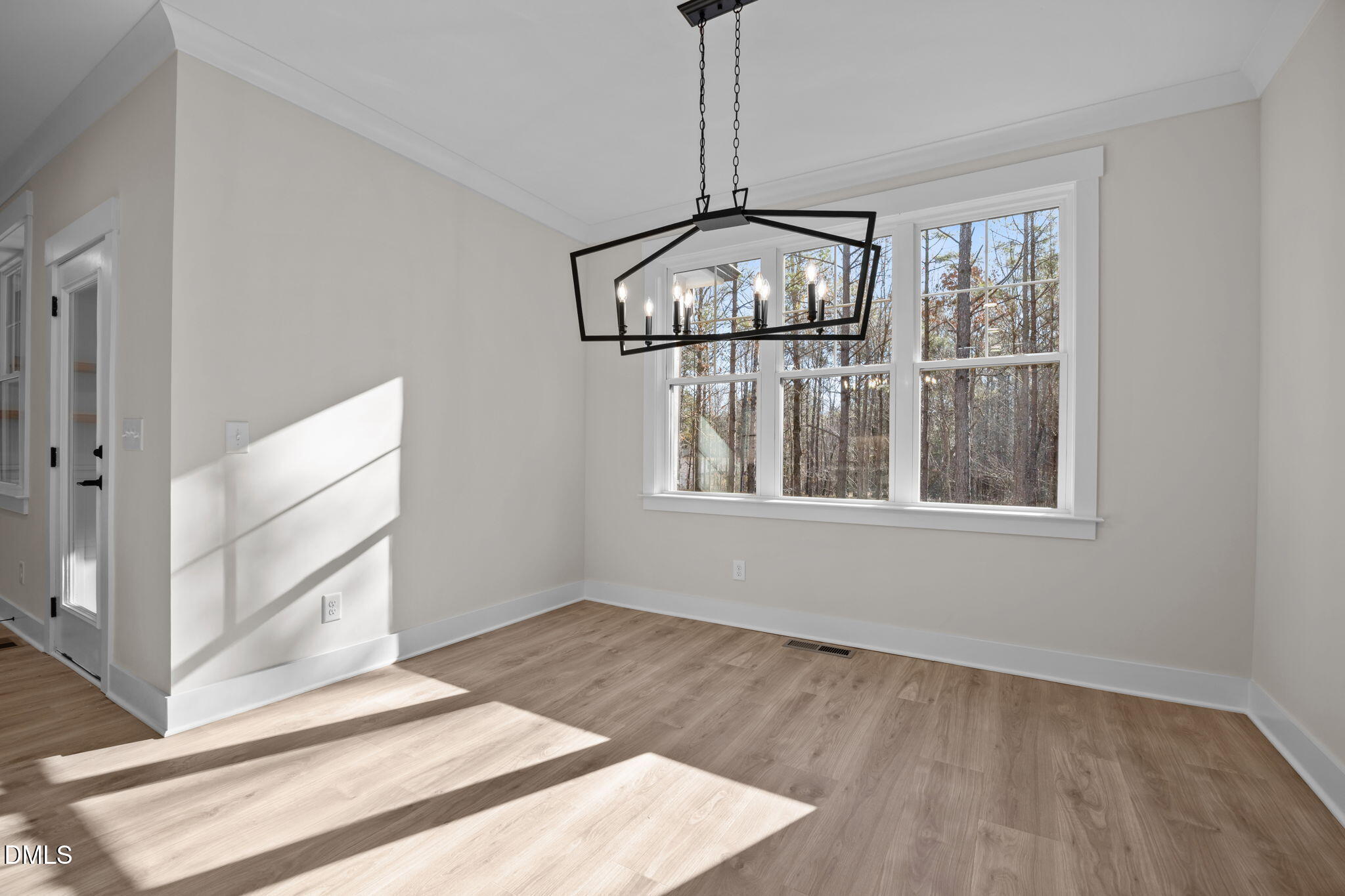 357 Slocum Drive Wendell, NC 27591 - Photo 17 of 48 a view of empty room with wooden floor and fan
