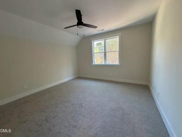 a view of a room that has a window in it