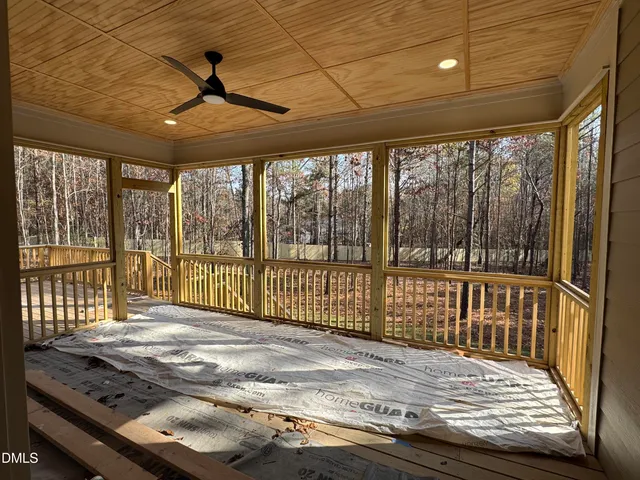 a view of a porch with wooden floor