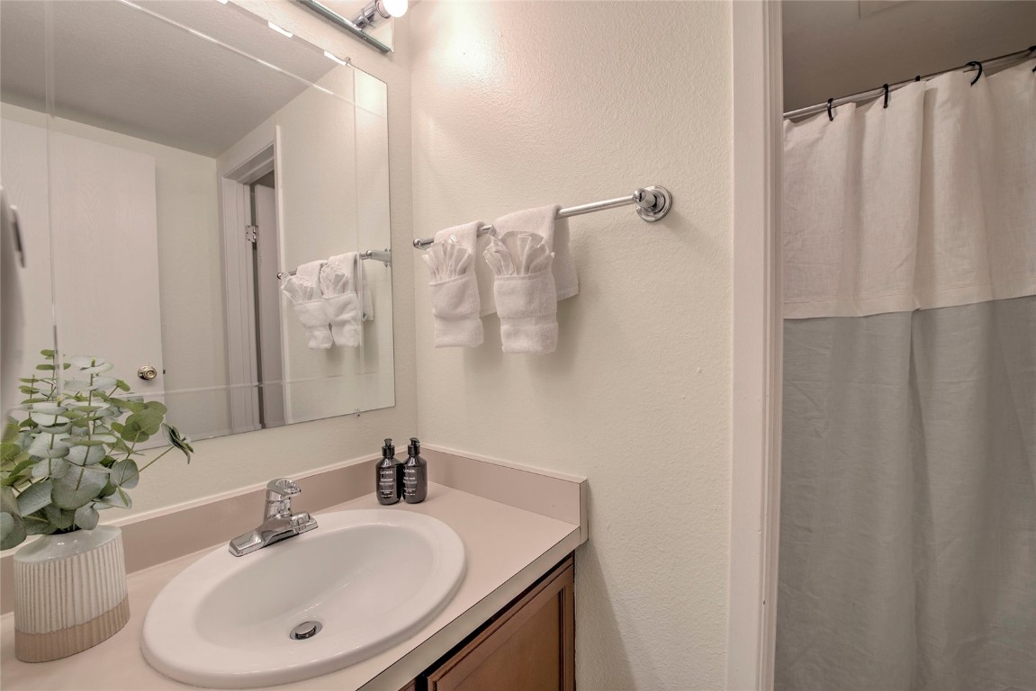 1977 Soda Ridge Road, Unit 1199 Keystone, CO 80435 - Photo 15 of 35 a bathroom with a sink and a mirror