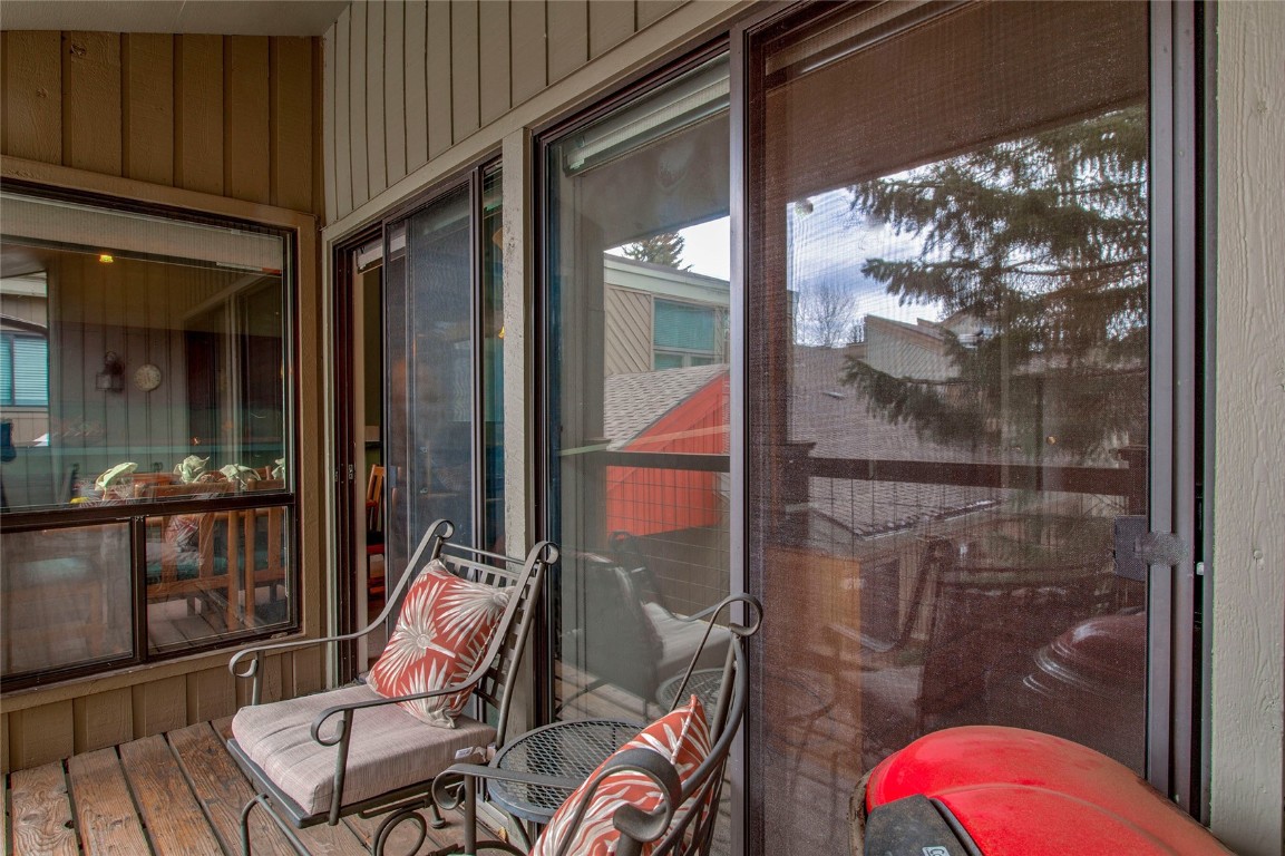 1977 Soda Ridge Road, Unit 1199 Keystone, CO 80435 - Photo 19 of 35 a view of a balcony with chair and front door