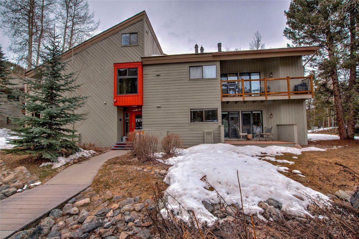 1977 Soda Ridge Road, Unit 1199 Keystone, CO 80435 - Photo 23 of 35 a front view of a house with a yard