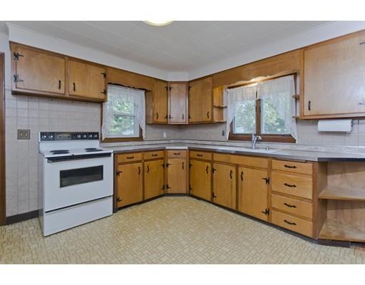 2029 Quaboag Street Three Rivers, MA 01080 - Photo 12 of 42 a kitchen with cabinets stainless steel appliances and a window