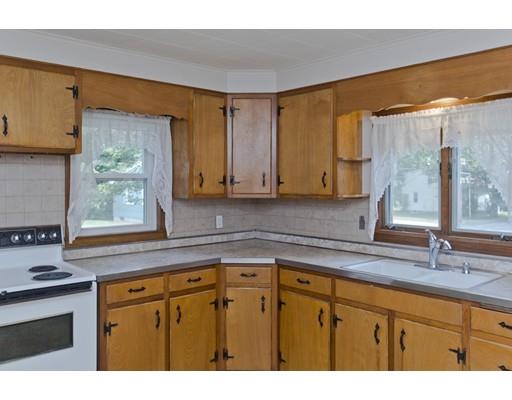 2029 Quaboag Street Three Rivers, MA 01080 - Photo 13 of 42 a kitchen with stainless steel appliances granite countertop a sink a stove and a microwave