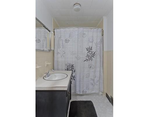 2029 Quaboag Street Three Rivers, MA 01080 - Photo 22 of 42 a bathroom with a granite countertop sink a toilet and shower