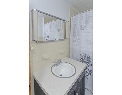 2029 Quaboag Street Three Rivers, MA 01080 - Photo 23 of 42 a bathroom with a sink and a mirror
