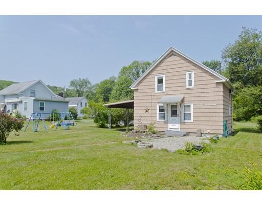 2029 Quaboag Street Three Rivers, MA 01080 - Photo 5 of 42 a front view of house with a garden and patio