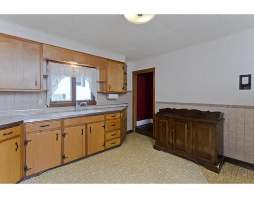 2029 Quaboag Street Three Rivers, MA 01080 - Photo 8 of 42 a kitchen with granite countertop a sink dishwasher a stove and a refrigerator with wooden cabinets