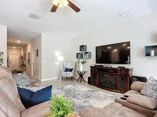 a kitchen with granite countertop wooden cabinets and stainless steel appliances