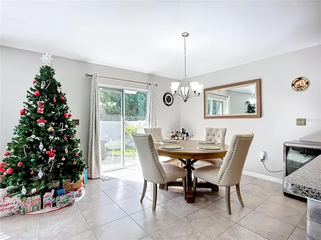 a kitchen with stainless steel appliances granite countertop a sink dishwasher stove refrigerator and cabinets