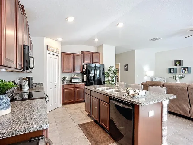 a bathroom with a double vanity sink and mirror