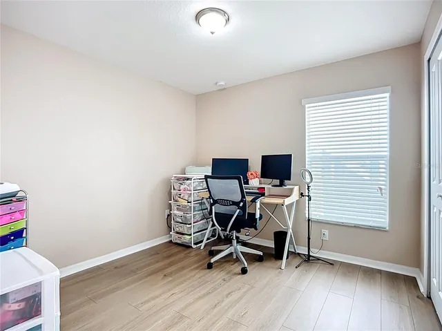 a bathroom with a granite countertop sink toilet mirror and shower