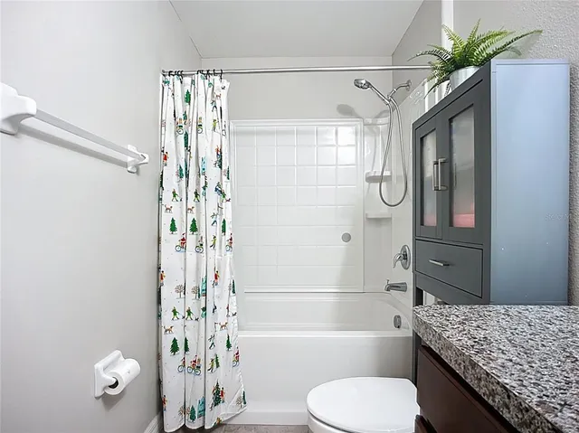 an aerial view of a house with a garden and plants