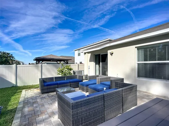 a view of a swimming pool with a lounge chair