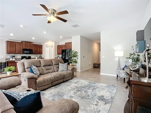 a living room with furniture and a window