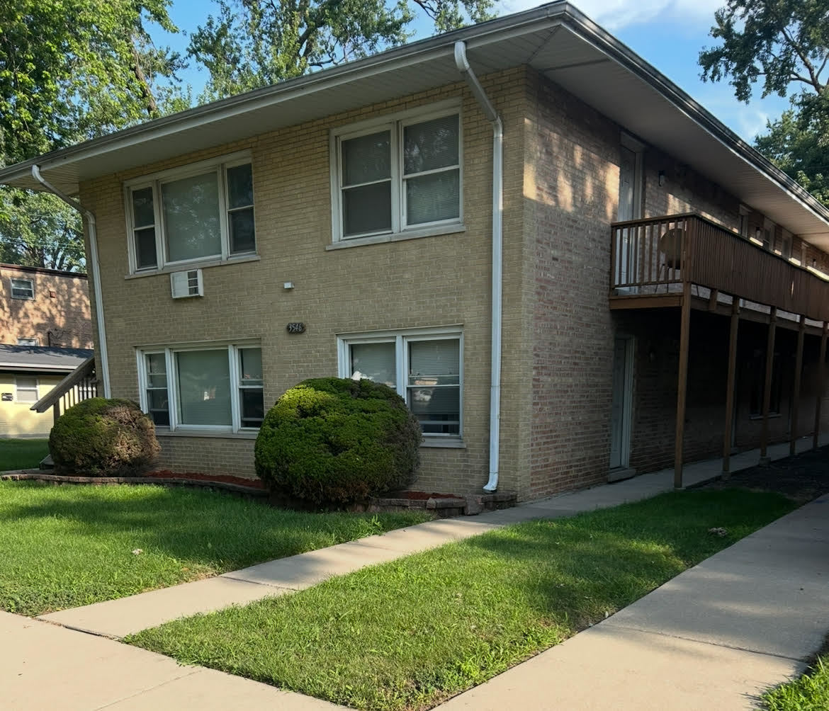 3546 147th Street Midlothian, IL 60445 - Photo 4 of 4 a view of a house with a garden and plants