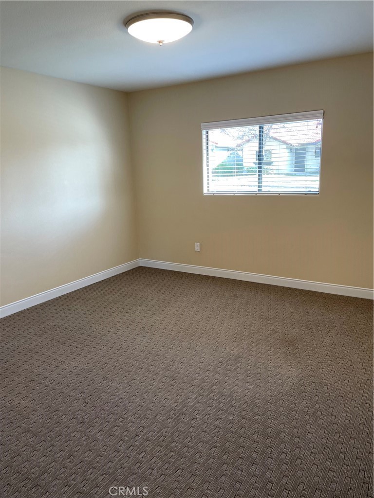 16737 Rickenbacker Circle Riverside, CA 92518 - Photo 4 of 17 an empty room with a window