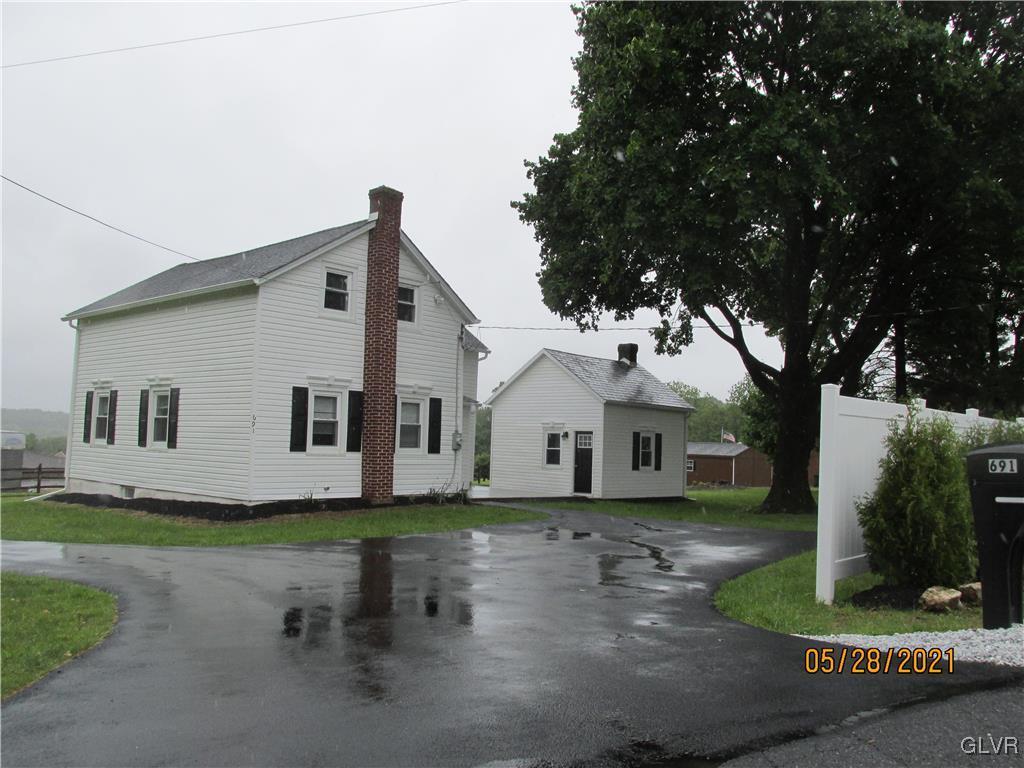 691 Bok Road Nazareth, PA 18064 - Photo 1 of 24 a front view of a house with a yard