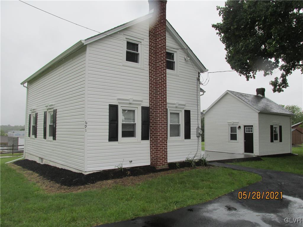 691 Bok Road Nazareth, PA 18064 - Photo 21 of 24 a view of a white house next to a yard