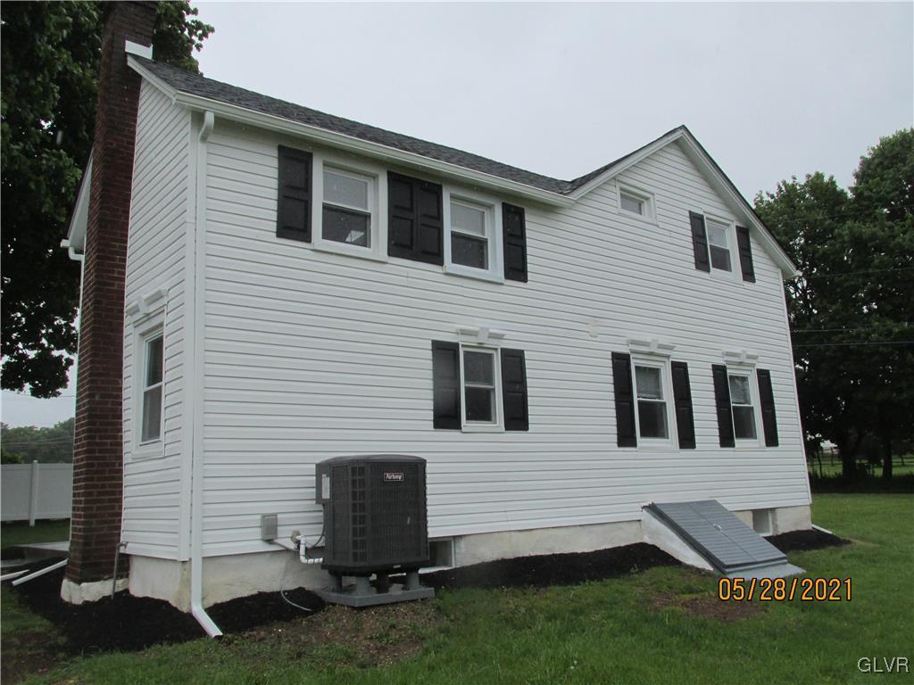 691 Bok Road Nazareth, PA 18064 - Photo 23 of 24 a view of a white house with a yard