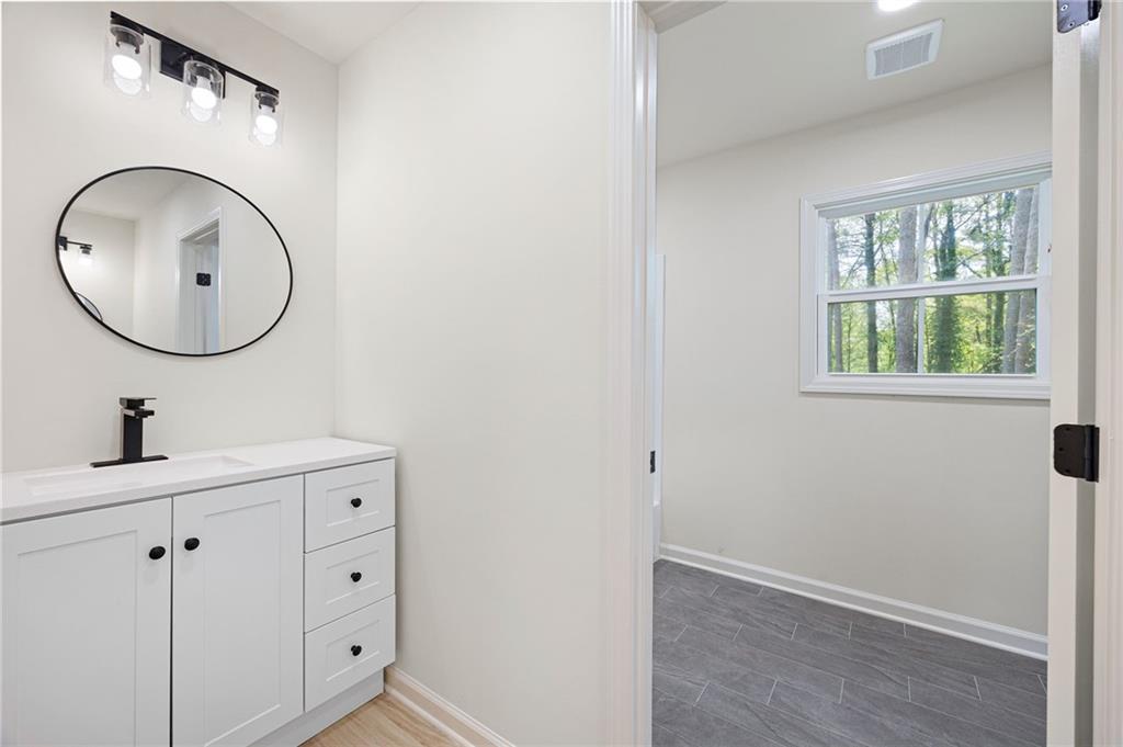 4289 Kimball Road Southwest Atlanta, GA 30331 - Photo 18 of 20 a bathroom with a sink and a mirror