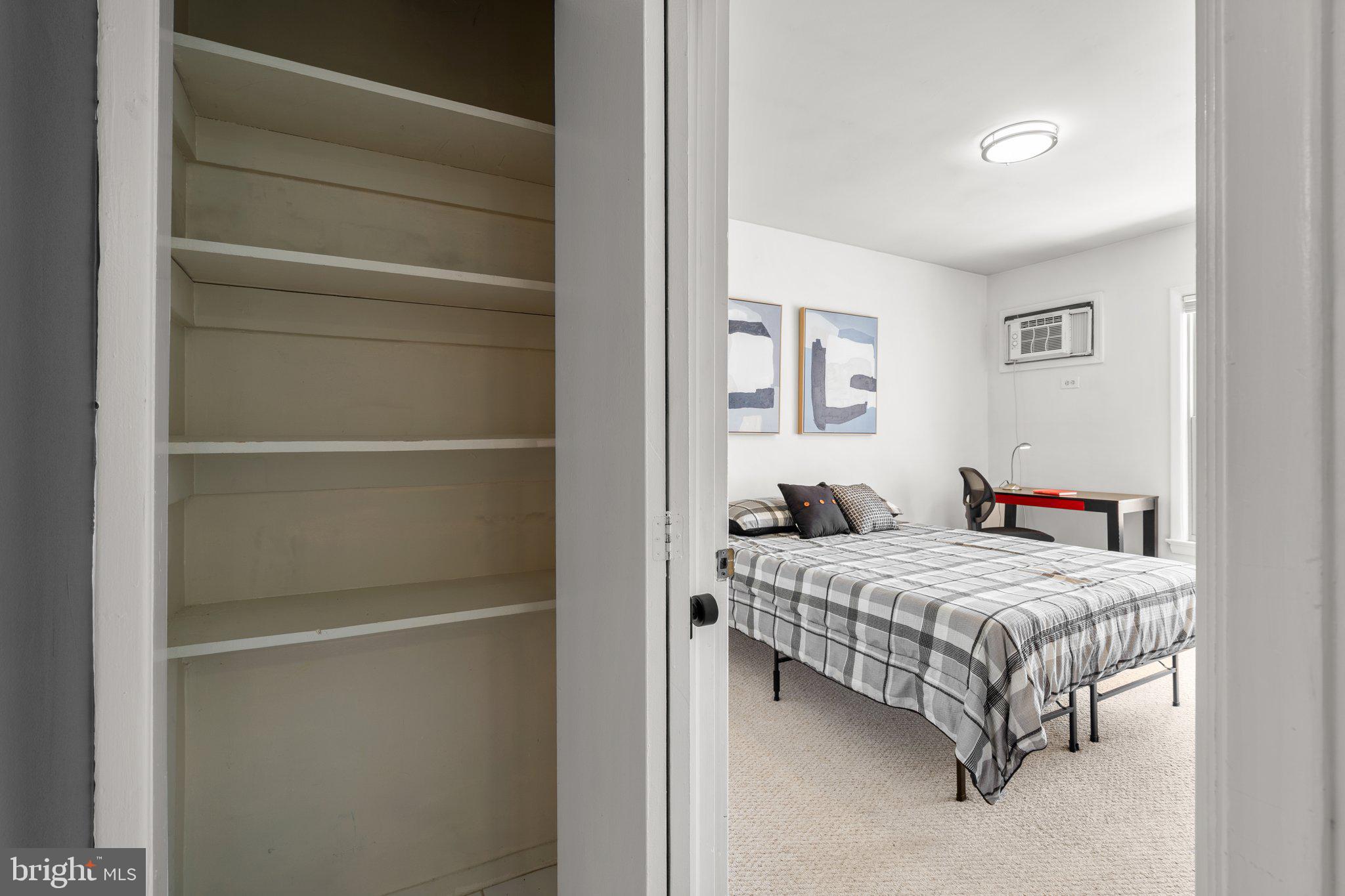2515 P Street Northwest, Unit 302 Washington, DC 20007 - Photo 18 of 27 a bedroom with a bed and a closet