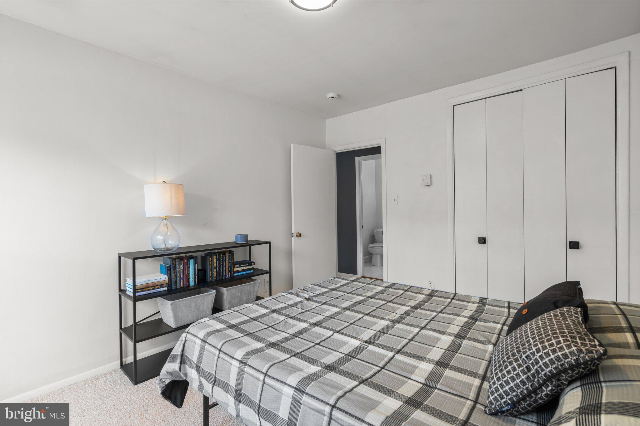 2515 P Street Northwest, Unit 302 Washington, DC 20007 - Photo 21 of 27 a bedroom with a bed and a bookshelf
