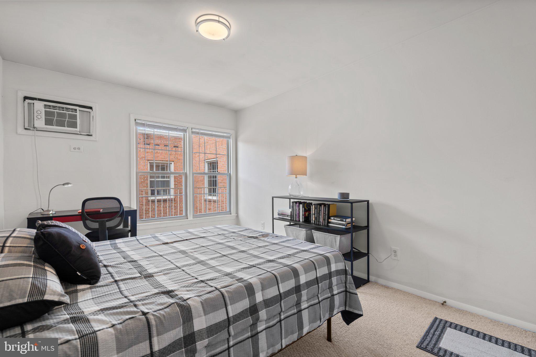 2515 P Street Northwest, Unit 302 Washington, DC 20007 - Photo 23 of 27 a bedroom with a bed and a window