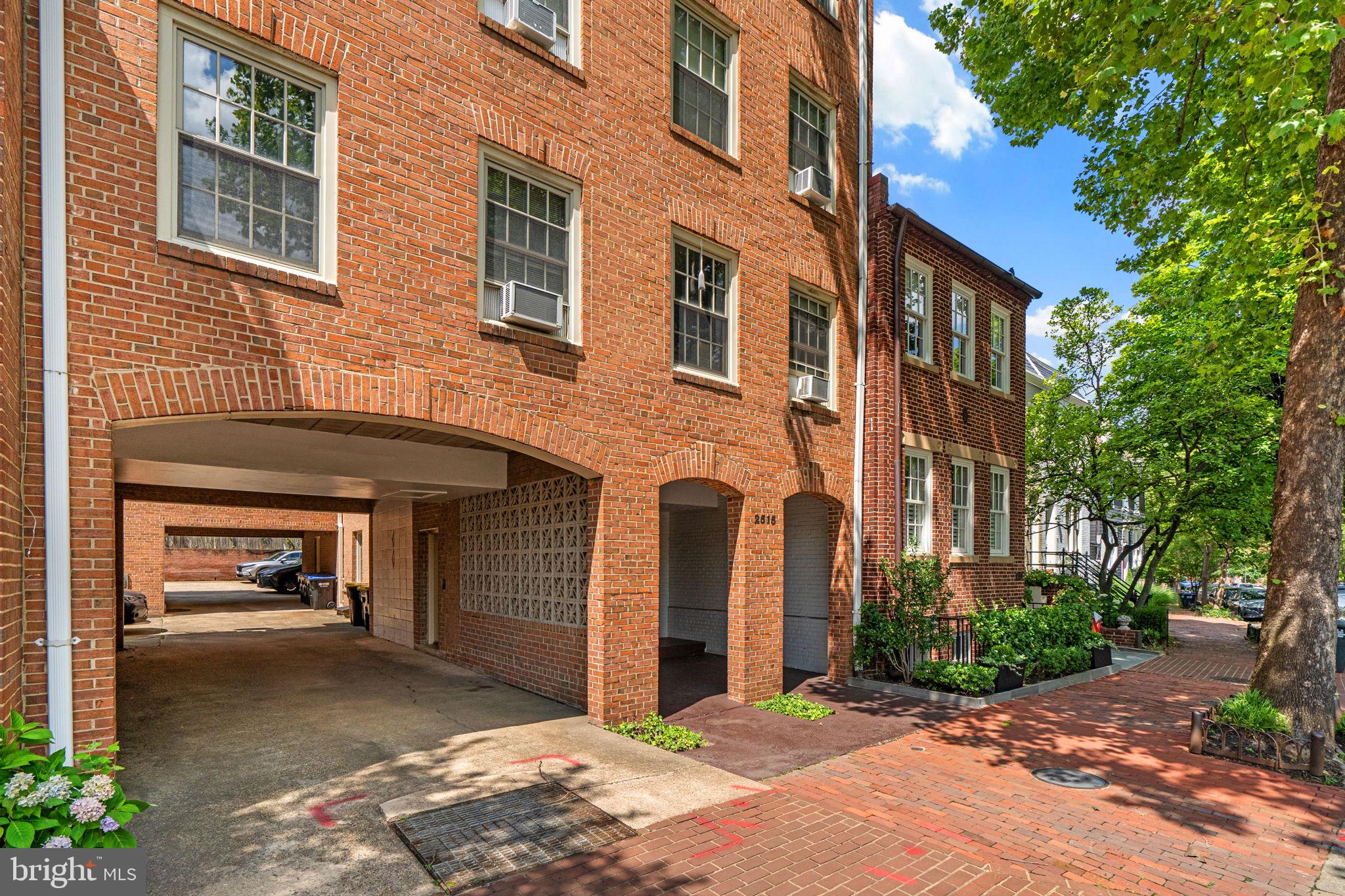 2515 P Street Northwest, Unit 302 Washington, DC 20007 - Photo 3 of 27 a front view of a house with a yard