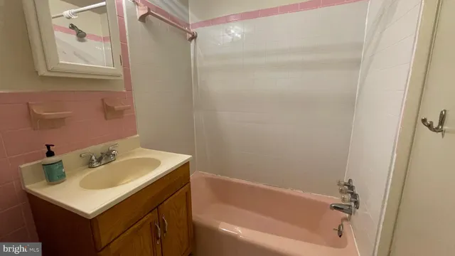 a bathroom with a sink and a bathtub