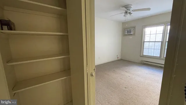 a view of an empty room with a window