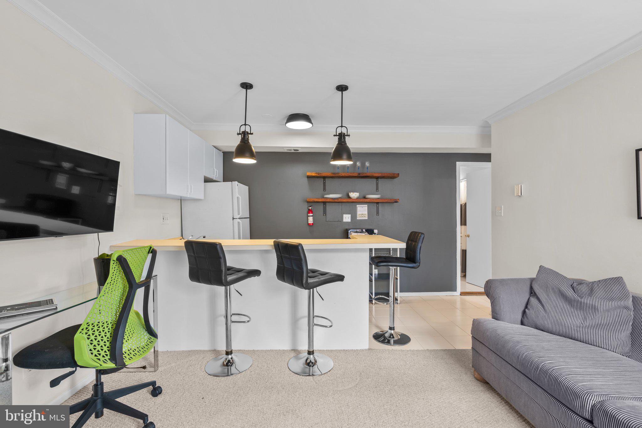 2515 P Street Northwest, Unit 302 Washington, DC 20007 - Photo 7 of 27 a living room with furniture and a flat screen tv