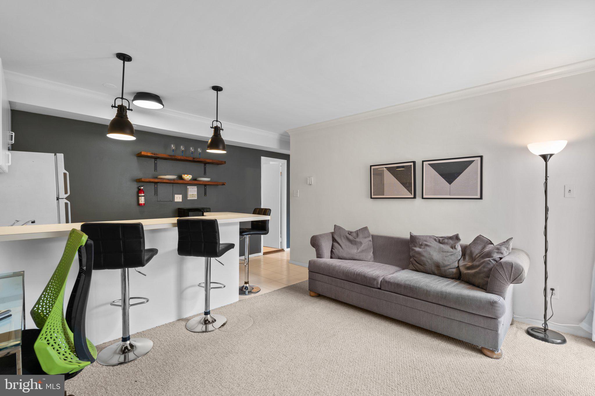 2515 P Street Northwest, Unit 302 Washington, DC 20007 - Photo 8 of 27 a living room with furniture and wooden floor