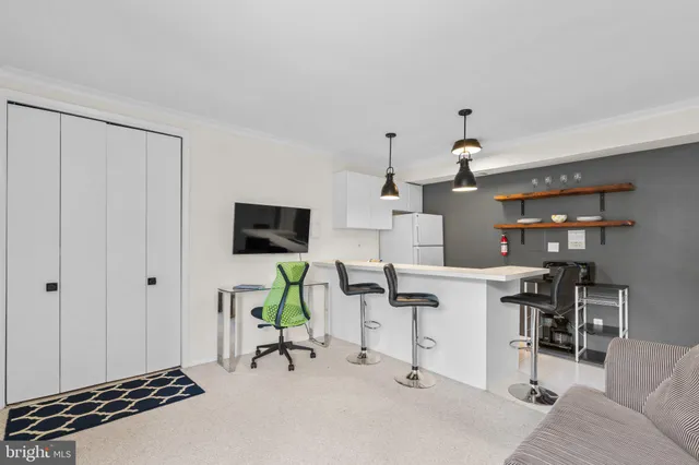 a workspace with furniture and a window