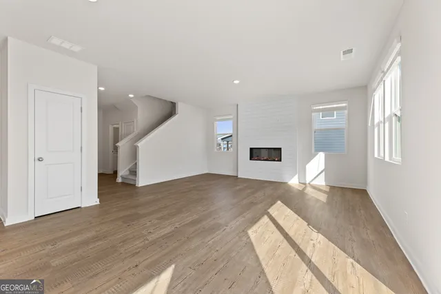 a view of kitchen with wooden floor