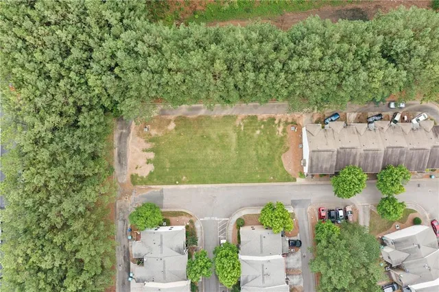 an aerial view of a house with a yard