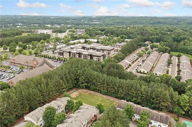 an aerial view of residential houses with outdoor space