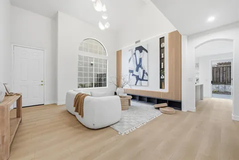 a spacious bedroom with a large bed and a window