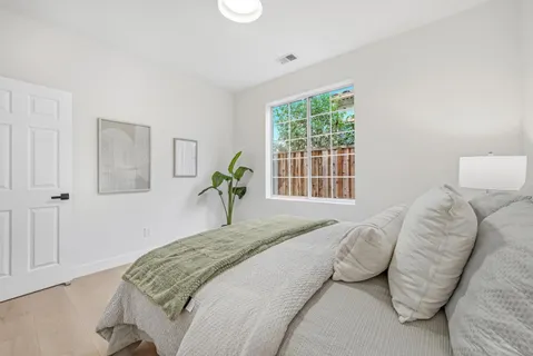 a white bath tub sitting next to a sink