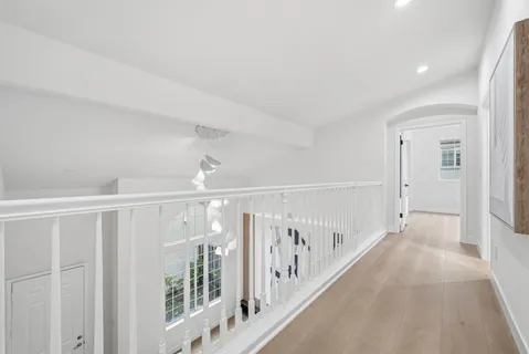 a bedroom with a bed and a lamp