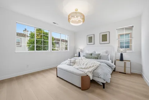 a bathroom with a double vanity sink mirror and bathtub