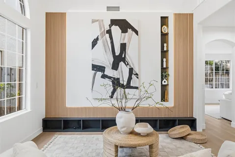 a living room with furniture and a potted plant