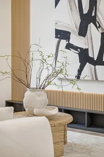 a bedroom with furniture and a window